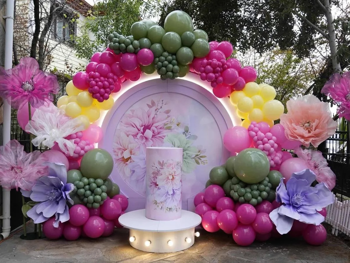 Colorful balloon and floral celebration backdrop