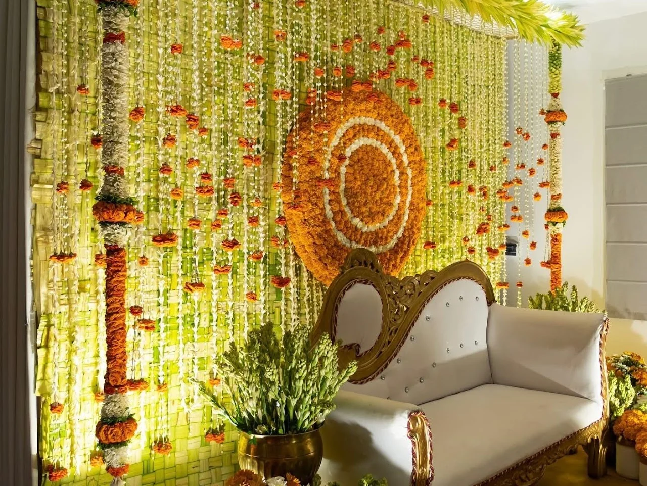Marigold garlands and traditional Indian details framing an intimate celebration lounge
