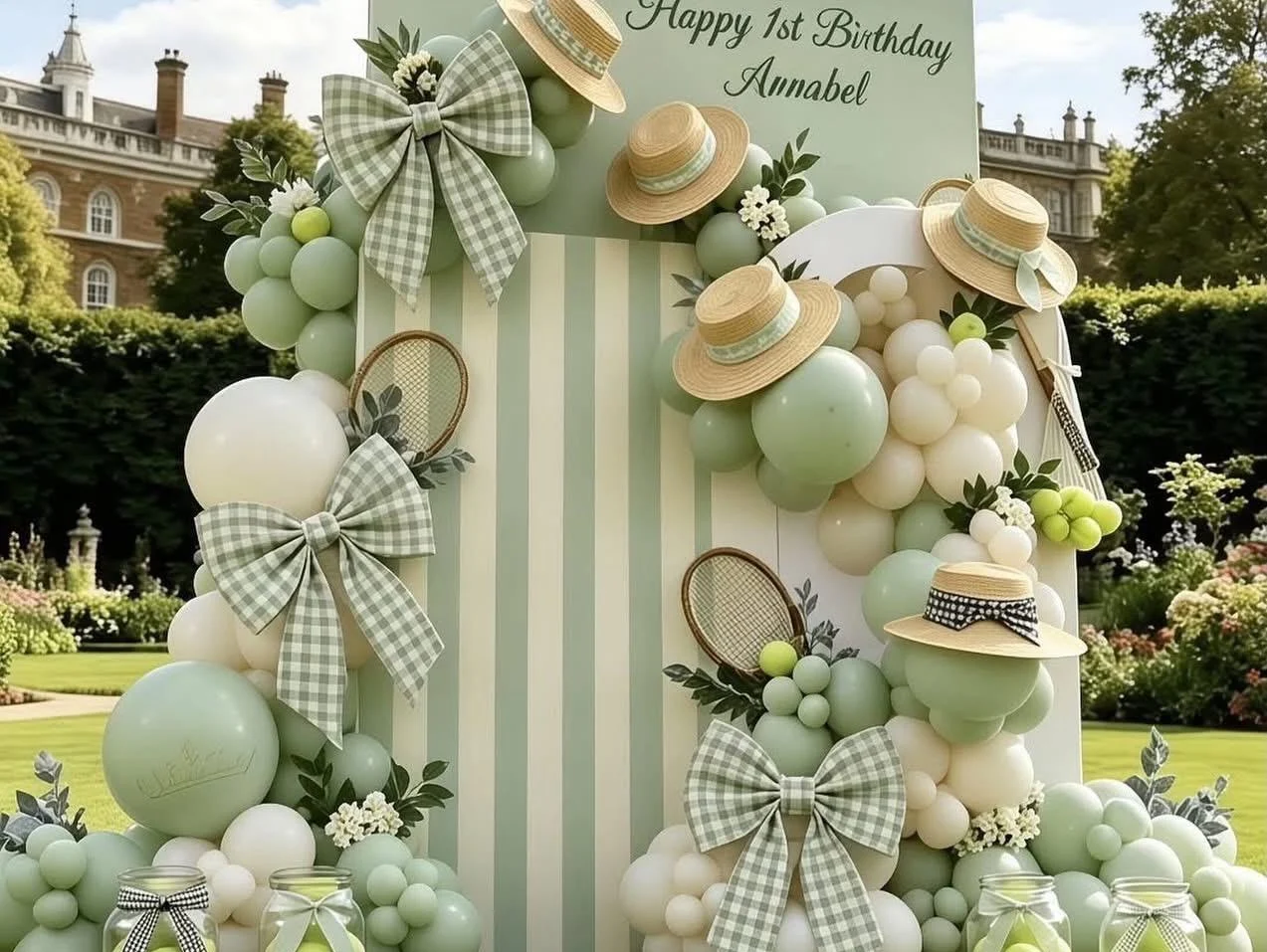 Sage green and ivory birthday backdrop with bows, balloons and floral details