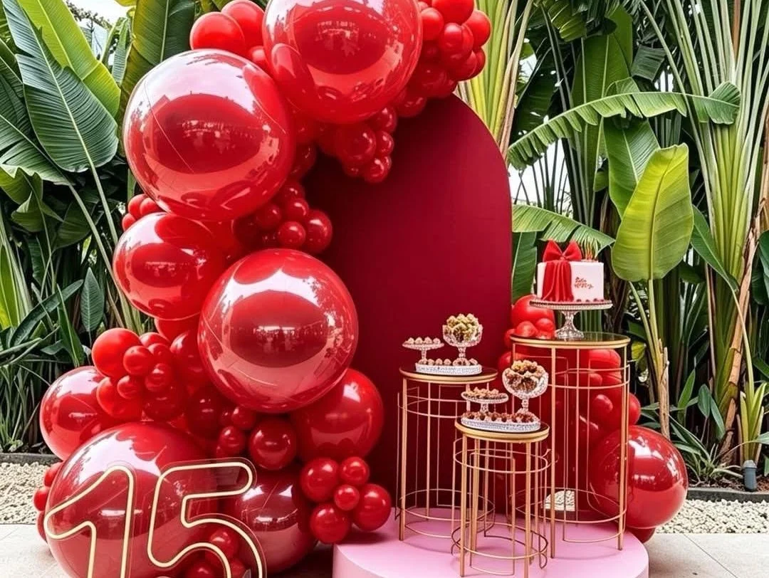 Red milestone birthday styling with balloons and florals